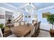 Large dining room with a chandelier, a hutch, and light blue walls at 450 Congress Pkwy, Lawrenceville, GA 30044