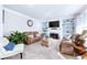 Bright living room featuring a fireplace, built-in bookshelves, and comfortable seating at 450 Congress Pkwy, Lawrenceville, GA 30044