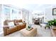 Sunlit living room with hardwood floors and a view of the backyard, comfortable seating at 450 Congress Pkwy, Lawrenceville, GA 30044