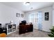 Well-lit home office featuring a desk, shelving unit, and a window with natural light at 450 Congress Pkwy, Lawrenceville, GA 30044