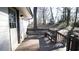 Inviting back porch with a built-in bench, perfect for relaxing outdoors at 4681 City View Dr, Forest Park, GA 30297