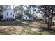 Large backyard with mature trees and ample space for outdoor activities and landscaping at 4681 City View Dr, Forest Park, GA 30297