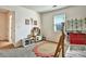 This bedroom features a bunk bed, a bright window, and a decorative oval rug at 5065 Timberbridge Ln, Johns Creek, GA 30022