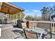 Deck showcasing outdoor dining set, grill, and ample space for entertaining at 5065 Timberbridge Ln, Johns Creek, GA 30022