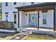 Charming front porch featuring a light blue door and a cozy seating area, creating a welcoming entrance at 5065 Timberbridge Ln, Johns Creek, GA 30022