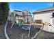 Backyard playground featuring a swing set and playhouse surrounded by mulch, ideal for Gathering fun and recreation at 5065 Timberbridge Ln, Johns Creek, GA 30022