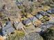 Overhead view of the house in a neighborhood, featuring mature trees and well-kept lawns, showcasing the property at 853 Erin Sw Ave, Atlanta, GA 30310