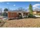 Brick home's backyard featuring a screened in porch, perfect for relaxation at 853 Erin Sw Ave, Atlanta, GA 30310