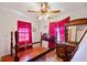 Bedroom featuring hardwood floors, ceiling fan, headboard, and dresser at 853 Erin Sw Ave, Atlanta, GA 30310