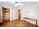 Empty bedroom features wood floors, ceiling fan, closet, and natural light at 853 Erin Sw Ave, Atlanta, GA 30310