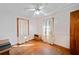 Bedroom with hardwood floors, a ceiling fan, and natural light from two windows at 853 Erin Sw Ave, Atlanta, GA 30310