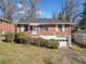 Charming brick home with well-maintained front yard and an attached garage, offering curb appeal and convenience at 853 Erin Sw Ave, Atlanta, GA 30310