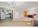 Bright living room featuring carpet and a large window, creating a comfortable space at 853 Erin Sw Ave, Atlanta, GA 30310