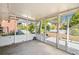 Enclosed sunroom space with tile flooring, large screened windows, and outdoor views at 853 Erin Sw Ave, Atlanta, GA 30310