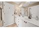 A well-lit bathroom featuring a double vanity with white cabinets at 330 Tupelo Trl, Canton, GA 30114