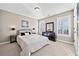 Sunlit bedroom with a comfortable bed, shutters, and ample closet space at 330 Tupelo Trl, Canton, GA 30114