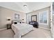 Bedroom featuring light gray walls, carpeted floors, windows with shutters, and a queen-sized bed at 330 Tupelo Trl, Canton, GA 30114