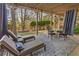Covered patio featuring outdoor seating, chaise lounges and tree views at 330 Tupelo Trl, Canton, GA 30114
