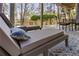 Seating area on covered patio offering views of wooded backyard at 330 Tupelo Trl, Canton, GA 30114