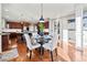 Bright dining area adjacent to the kitchen with hardwood floors and stylish decor at 330 Tupelo Trl, Canton, GA 30114