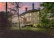 Back view of a house with large windows, a screened-in porch, and a green yard at 330 Tupelo Trl, Canton, GA 30114