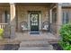 Charming front porch with stone accents, seating, and a decorative wreath at 330 Tupelo Trl, Canton, GA 30114