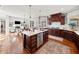 Open concept kitchen with marble island, stainless steel appliances, and hardwood floors at 330 Tupelo Trl, Canton, GA 30114