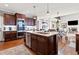 Elegant kitchen with stone counters, stainless appliances and a large center island at 330 Tupelo Trl, Canton, GA 30114