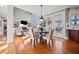 Open-concept living room with large windows, a fireplace, and hardwood floors at 330 Tupelo Trl, Canton, GA 30114