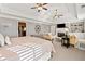 Bright main bedroom with a fireplace, sitting area, and built-in shelving at 330 Tupelo Trl, Canton, GA 30114