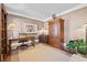 Spacious home office with hardwood floors, a desk, and a large armoire at 330 Tupelo Trl, Canton, GA 30114