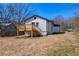 Home features a wooden deck overlooking a large backyard, perfect for relaxing or entertaining guests at 8176 Camp St, Douglasville, GA 30134