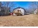 Home features a wooden deck overlooking a large backyard, perfect for Gathering and gatherings at 8176 Camp St, Douglasville, GA 30134