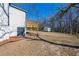 Home features a backyard with a wooden deck perfect for outdoor relaxation and entertaining at 8176 Camp St, Douglasville, GA 30134