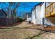 Backyard with a wooden deck, creating a comfortable outdoor space with fenced perimeters at 8176 Camp St, Douglasville, GA 30134