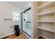 Bathroom featuring a black toilet and a glass shower at 8176 Camp St, Douglasville, GA 30134