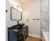 Modern bathroom with marble wall tiles and vessel sink at 8176 Camp St, Douglasville, GA 30134