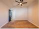 Clean bedroom with hardwood floors and a modern ceiling fan offers a simple, comfortable design at 8176 Camp St, Douglasville, GA 30134