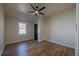 Bedroom features ceiling fan, wood-look flooring and window at 8176 Camp St, Douglasville, GA 30134