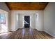 Bright entryway featuring luxury vinyl floors, natural light, and a beautiful wood plank ceiling at 8176 Camp St, Douglasville, GA 30134