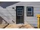 View of the back door and deck of the house with new siding at 8176 Camp St, Douglasville, GA 30134