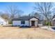 Charming renovated home with updated curb appeal and a well-manicured lawn at 8176 Camp St, Douglasville, GA 30134