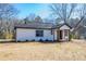 Newly renovated home with fresh exterior paint, and a inviting porch at 8176 Camp St, Douglasville, GA 30134