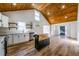 Bright kitchen with white cabinets, wood ceiling, quartz countertops, and an open layout at 8176 Camp St, Douglasville, GA 30134