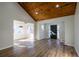 Living room featuring luxury vinyl floors, natural light, and a beautiful wood plank ceiling at 8176 Camp St, Douglasville, GA 30134