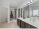 Neutral bathroom featuring dual sink vanity, stand up shower, separate soaking tub, and lots of natural light at 1227 Clear Stream Rdg, Auburn, GA 30011