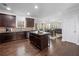 Gorgeous kitchen with central island, stainless appliances, and dark wood cabinets at 1227 Clear Stream Rdg, Auburn, GA 30011