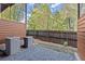 Private townhome patios with gravel, wood privacy screens, and natural surroundings at 2327 Mason Dr # D23, Atlanta, GA 30316