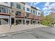 Contemporary townhomes with balconies and garages, set against a backdrop of lush greenery at 2327 Mason Dr # D23, Atlanta, GA 30316