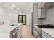 Bright, modern kitchen with stainless steel appliances and an island sink at 2327 Mason Dr # D23, Atlanta, GA 30316